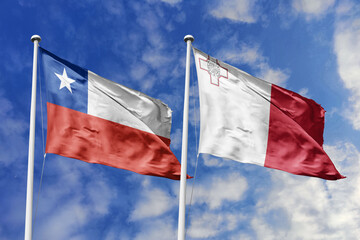 Flags of Chile and Malta Waving Together Against a Dynamic Blue Sky, Symbolizing International...