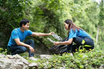 Volunteer Team Collecting Waste in Nature. Two individuals working together for environmental sustainability.