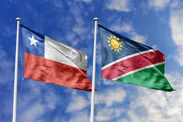 Flags of Chile and Namibia Waving Together Against a Blue Sky, Symbolizing International Relations...