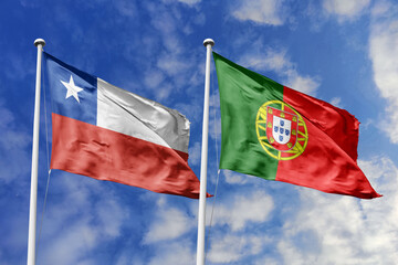 A Burkina Faso and Portugal flag, a metaphor for European-African ties, wave together against a blue sky, symbolizing friendship and cultural exchange.