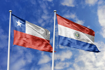 A Burkina Faso and Italy flag, a metaphor for European-African ties, wave together against a blue sky, symbolizing friendship and cultural exchange.