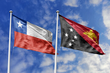 Chile and Papua New Guinea flags waving, symbolizing unity. Red, white star meets black, red, yellow with bird, representing strength and heritage.