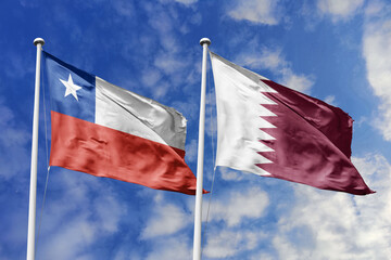 Chile and Qatar flags waving under a bright sky, symbolizing unity and ties. Red, white star of Chile meets Qatar's white and maroon with serrated edge, representing strength and harmony.