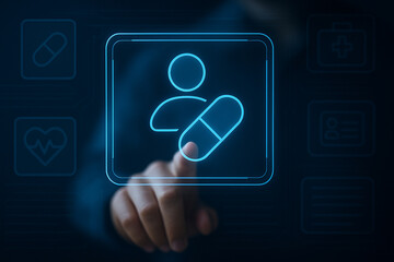 Futuristic digital healthcare interface showing hand selecting user profile with pill icon in holographic medical technology concept screen