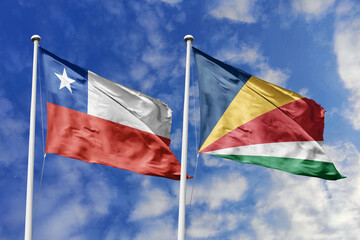 The Flags of Chile and Seychelles Waving Together, Symbolizing Diplomatic Relations Between Diverse Nations.