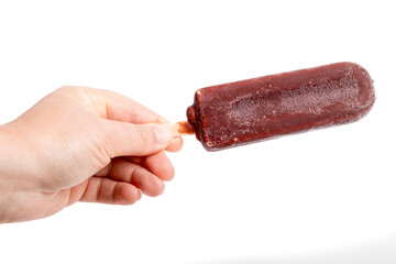 Hand holding a chocolate popsicle showcasing a frozen treat against a white background