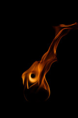 Captivating Flame Against Dark Background with Fluid Movement and Color