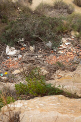 Overlooking the natural landscape marred by waste in Spain's scenic terrain during a quiet afternoon