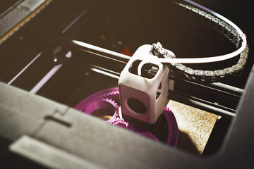 3D printing of a planetary gear model – top view of FDM printer extruding magenta filament for...