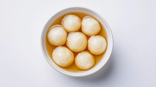 Top view of rasgulla in bowl on white background