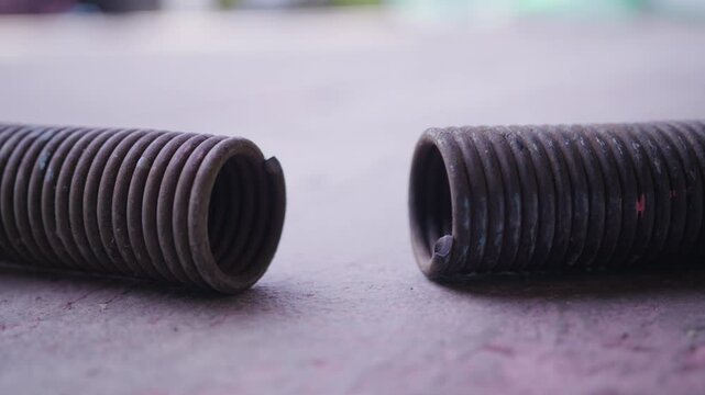 Broken Garage Door Spring Close-Up | Damaged Torsion Tension Spring