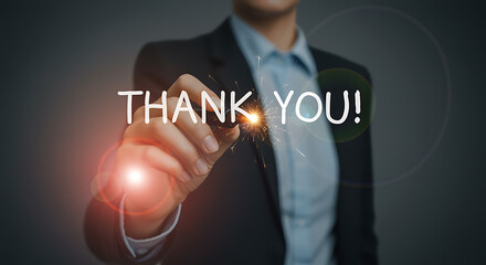 Business professional writing thank you using sparkler with glowing light and appreciation