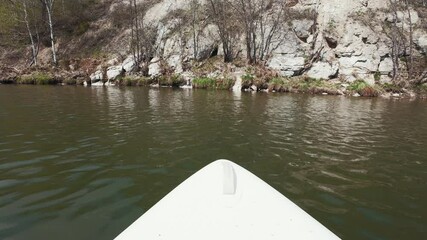 Experience a serene kayaking adventure on calm waters, surrounded by breathtaking cliffs and lush greenery, perfect for nature enthusiasts seeking relaxation and exploration in a peaceful setting