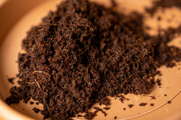 Close up of rich organic soil texture or peat moss, natural compost background for gardening, farming, agriculture, plant growth, landscaping, eco friendly horticulture, or potting mix 