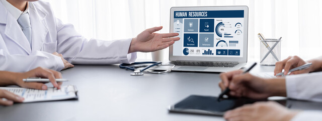 Human resources management software on computer screen helping human resources employee to manage recruitment, payroll, staff searching and KPI evaluation brisk