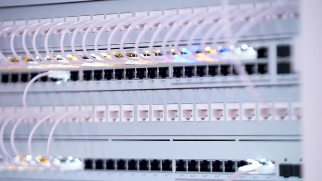 Switching hubs in IPS server room with cables and glowing lights