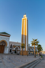 Scenic views of Tangier's seafront and old medina walls on a sunny day, showing a mix of coastal charm, public spaces, and historic Moroccan architecture