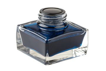A vintage glass ink bottle with blue ink on a black background isolated