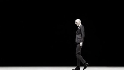 modern actor striking abstract pose wearing dramatic mask that conveys deep emotion