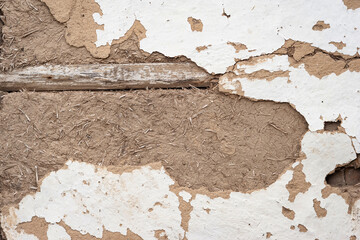 Cracked clay wall. Old plaster