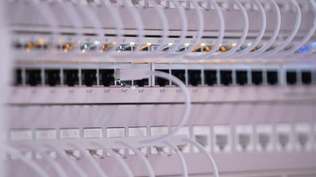Switching hubs in IPS server room with cables and glowing lights