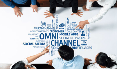 A diverse team collaborates on an omni-channel strategy focused on enhancing customer engagement through various digital marketing and communication solutions. Amity