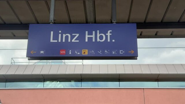 Linz main train station sign on platform