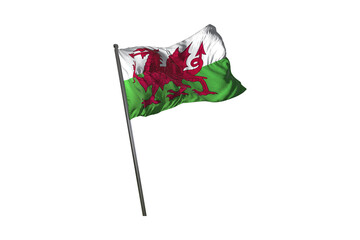 The national flag of wales waving in the wind against a black background