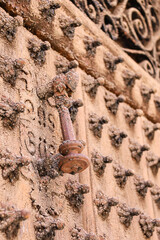 Vintage doorknocker on old wooden door