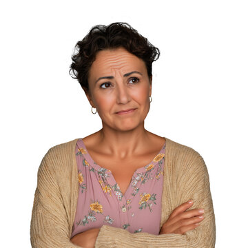 Middle-age Hispanic woman with worried and anxious expression, looking off to side with arms crossed, isolated on white or transparent background