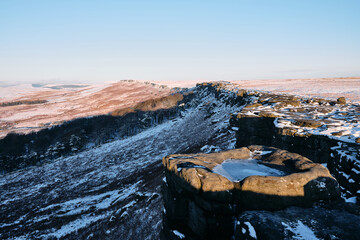 Morning light on Stanage Edge with snow, Peak District, UK