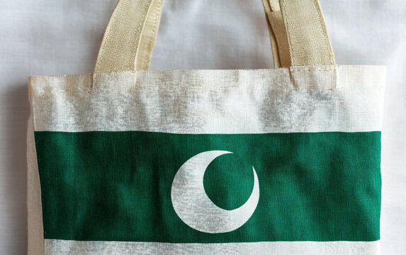 Stunning close-up of a Pakistan flag-themed tote bag showcasing intricate green and white decoration. Generative AI.