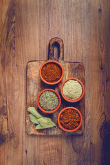 Georgian spices, in ceramic bowls, assortment, set of spices, utsho, adjika, Svan salt, ground coriander, top view, no people,
