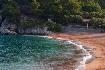 Montenegro, Budva Riviera, pink sand beach and Sveti Stefan Park, on the Adriatic Sea Coast. Horizontally
