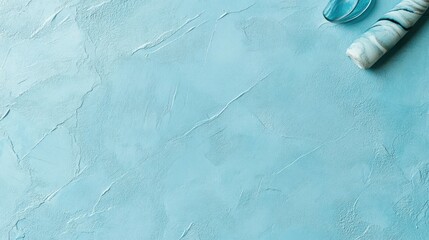 A calm, modern blue background in a softened shade, featuring a fine spackled texture and a smooth, velvety finish for a polished, elegant appearance.