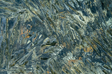 needles and crystals of melting transparent ice on the pebble shore of the northern Kolyma