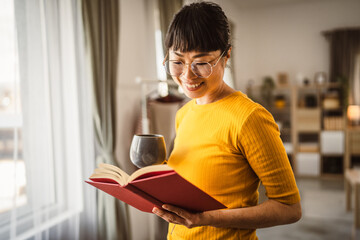 one female mature japanese woman read book at home