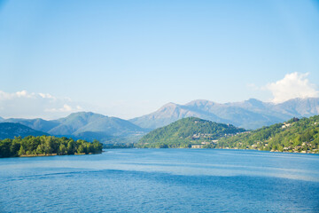 Spring view of Lake Lugano in the town of Caslano in the Swiss mountains