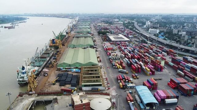 Drone footge of Chittagong of chattogram port yard and container handling from ship. Container yard, key grantee crane,mother vessels and loading unloading photographs.