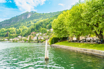 Spring view of Lake Lugano in the town of Caslano in the Swiss mountains
