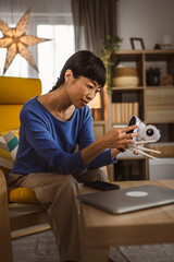 mature japanese woman adjust prepare home surveillance security camera