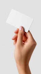 Woman hand holding blank white credit card on white background