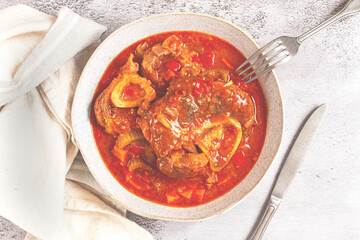 ossobuco, stewed meat knuckle on the bone, with oats and spices, homemade, no people,