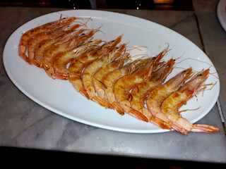 Delicious grilled shrimp presentation on white plate for seafood lovers