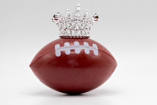 rugby or american football with a crown on it