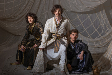 Charismatic guys in oriental costumes. Arabic or Turkish style, costume photography