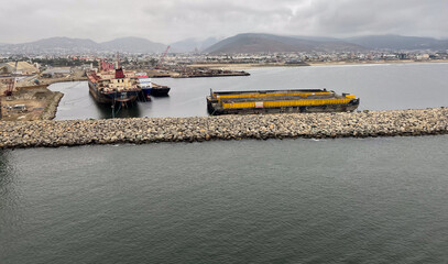 Ensenada, Mexico, June 5, 2025: The Entrance to Ensenada Harbor looking at the industrial Quay Dock where ships are repaired and anchored