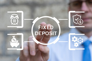 Benefits of fixed deposit an investment option concept. Business person using virtual touch screen presses the inscription: FIXED DEPOSIT.