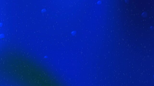Deep blue ocean scene with small floating particles.