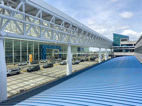 CLT Airport Exterior with Glass Terminal and Blue Roof Canopy

